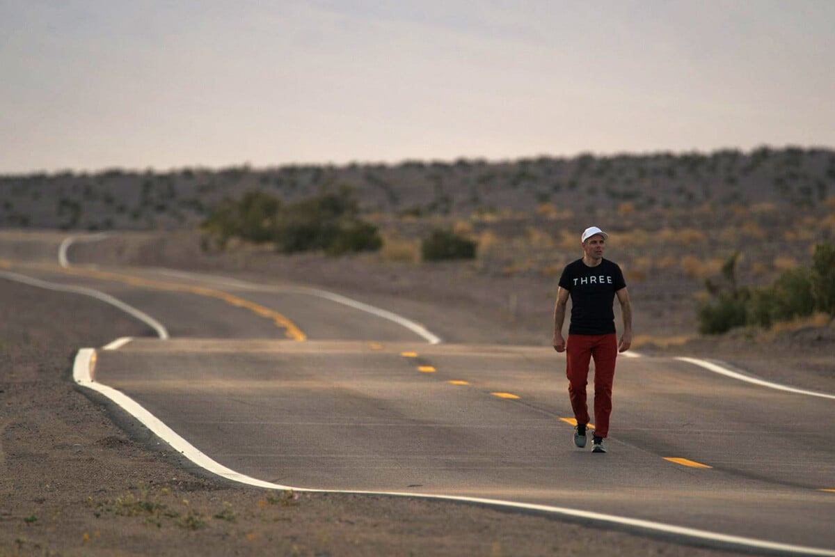 Dr. Dan Gubler walking through the desert of Death Valley looking onward towards exploration