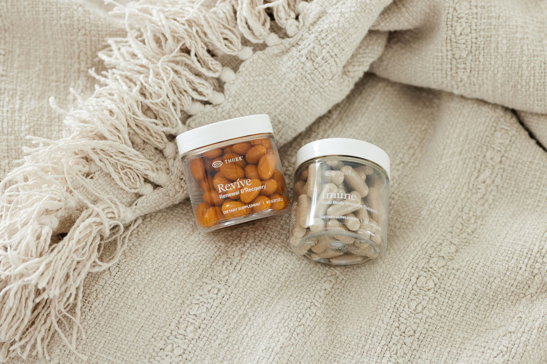 A container of Revíve and Imúne by THREE supplements formulated for gut health