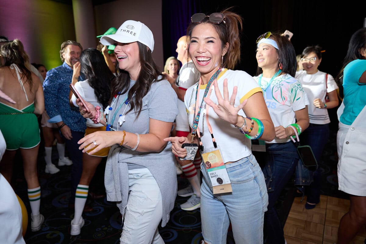 Smiling women walking into the THREE international convention in Salk Lake City Utah