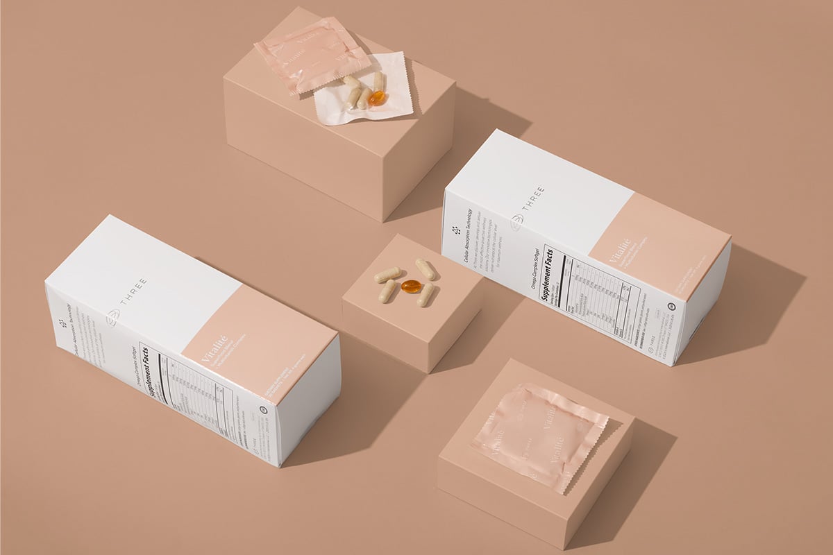 Vitalité by THREE sitting on a tan background formulated with prebiotics for gut health